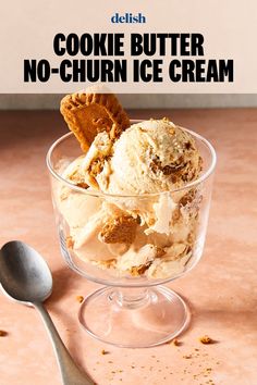 a bowl filled with ice cream on top of a table next to a silver spoon