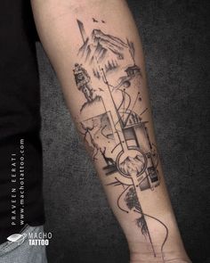 a man's arm with a clock and mountains tattoo on the left inner forearm