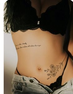 a woman with a tattoo on her stomach