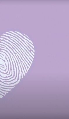 a fingerprint in the shape of a heart on a lilac background with copy - space