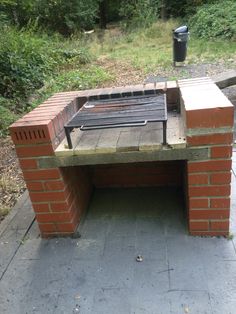 an outdoor bbq grill made out of bricks