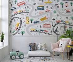 a child's room with cars and trucks painted on the wall, along with toys