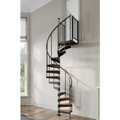 a spiral staircase in an empty room