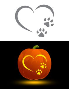 an orange pumpkin with paw prints in the shape of a heart