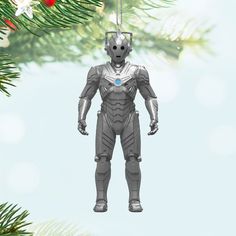 a robot ornament hanging from a christmas tree