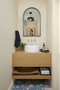 there is a sink and mirror in the bathroom