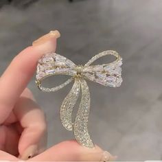 Bow Tie Zircon Rhinestone Brooch Female Simple Personality Fashion Pin Suit Anti-Light Corsage Brand New Glamorous Bling Brooches As A Gift, Glamorous Crystal Brooch As Gift, Glamorous Bling Brooches As Gift, Glamorous Crystal Brooches As Gift, Glamorous Crystal Brooches For Gifts, Formal Crystal Embellished Brooches, Gold Crystal Brooches For Party, White Party Brooches With Rhinestones, White Rhinestone Party Brooches