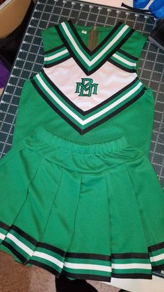 Cheerleading costume, constructed of ponte knit fabric, and knit braid. Bloomers are not included. Machine wash and dry. Smoke free and pet free home. Many colors and sizes available. If you have a special request convo me. Fitted Cotton Sets For Coming Home, Cotton Fitted Coming Home Outfit Sets, Winter School Sets With Fitted Stretch, Green Fitted Sports Sets, Stretchy Green Winter Sets, Green Cotton School Sets, Green Stretch Sets For Winter, Fitted Cotton Cheerleading Sets, Fitted Green School Sets