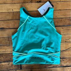 Super Cute, Beautiful Teal Color. Brand New With Tags, Retails For 48$ And Sold Out! #Nike #Athleisure #Y2k #Sportswear #90s #00s Green Cropped Sporty Tank Top, Green Casual Crop Top For Sports, Casual Crop Top For Training, Casual Training Crop Top, Sporty Green Racerback Top, Fitted Green Top With Go-dry, Green Fitted Functional Tank Top, Fitted Green Tops With Go-dry Technology, Functional Fitted Green Tank Top