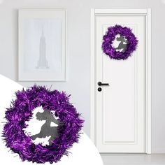 a purple wreath sitting in front of a white door next to a black and white photo