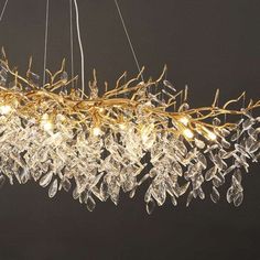 a large chandelier with many lights hanging from it's sides and branches