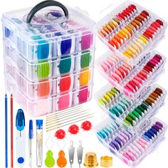 an assortment of crafting supplies including scissors, thread, needles and other items in plastic storage containers