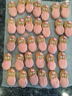 cookies with pink frosting and decorated like owls