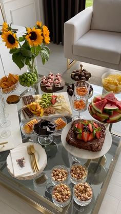 a glass table topped with lots of desserts