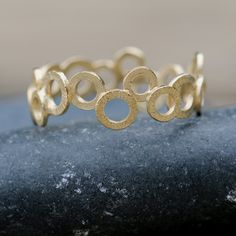 "Very chic and trendy jewelry piece, this gold filled ring is handmade with a unique and stylish design. A chic piece you can wear with other dainty, stacking rings to create your own wonderful style. Why purchase this gold ring? One you can wear on an everyday basis and mix or match with other pieces✅ The ring is expertly handmade with craftsmanship and high-quality materials ✅ Available in ring sizes 5 to 10 ½ US ✅ Wearable alone or with other stacking ring pieces ✅ Thoughtfully packaged in a Adjustable Round Midi Rings In Recycled Gold, Adjustable Recycled Gold Midi Rings, Gold Stackable Round Rings For Promise, Gold Stackable Rings Made Of Recycled Gold, Yellow Gold Circular Jewelry With Ring Detail, Modern Gold Stackable Rings, Everyday Gold Circle Midi Rings, Elegant Gold Open Circle Ring, Everyday Gold Midi Rings