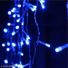 blue christmas lights are hanging from the ceiling