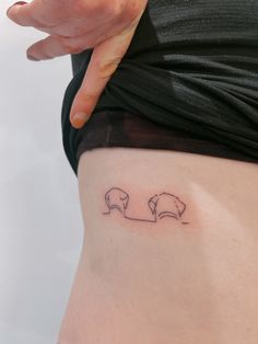 a woman's stomach with two elephants on it