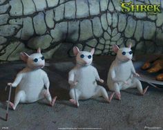 three white mice sitting on top of each other in front of a stone wall with the caption tres ratones cleos