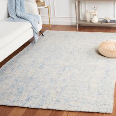 a white and blue rug in a living room