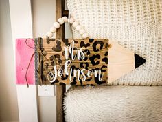 this is an image of a wooden sign with leopard print on it that says, this person