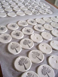 the table is covered with many different types of buttons and placemats on it