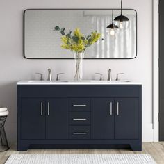 a bathroom vanity with two sinks and a large mirror above it, next to a stool