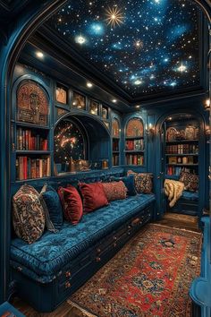 a living room filled with blue couches and bookshelves under a sky filled with stars