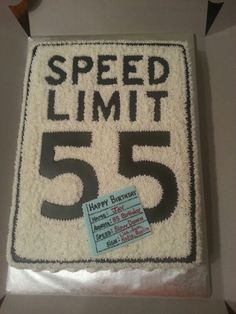 a cake that is shaped to look like a speed limit sign with the number 55 on it