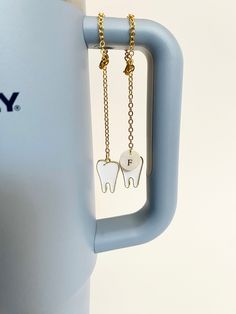 "This Stanley tumbler charm is great for a dentist, dental assistant, hygienist, orthodontist, receptionist, client gift, promotional gift, or dental office gift. The accessory is made to order with your choice of chain color and length, a mother of pearl monogrammed shell, and a gold enamel charm. There is a lobster clasp to close the chain. Custom orders accepted. HOW TO PERSONALIZE AND ORDER: 1. From the customization options, select the charm style, chain color, and chain length you prefer. Hygienist Gifts, Dental Assistant Gifts, Dental Aesthetics, Dental Hygiene School, Dental Gifts, Dental Life, Assistant Gifts, Stanley Tumbler, Gifts For Dentist