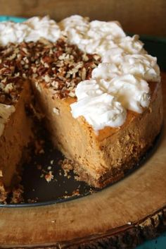 there is a cake with white frosting and nuts on the top that has been cut in half