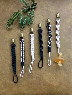 four different types of lanyards are lined up next to each other on a table