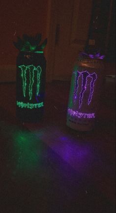 two mason jars with neon lights on them