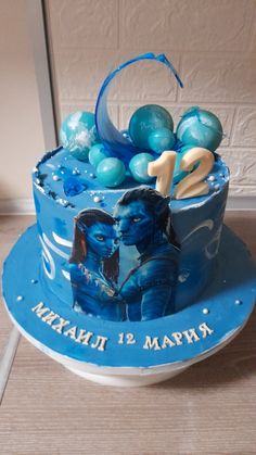 a birthday cake with blue decorations on it