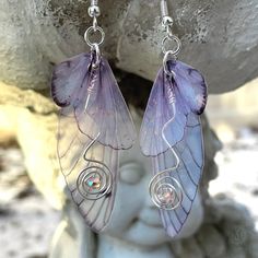 These beautiful dainty pink butterfly wing dangle earrings are the perfect addition to any fairy-inspired or ethereal look. The double wings design adds a touch of whimsy and movement, while the glittered top wing sparkles in the light. These fairy wing earrings feature copper or silver-colored swirled wires embellished with a pink crystal with a luster finish which catches the light in rainbow colors. These butterfly wings have three different ear wire selections to choose from, bare copper, ni Fairytale Jewelry, Fairy Wing Earrings, Butterfly Dangle Earrings, Fairy Tale Jewelry, Princess Drawings, Glitter Top, Butterfly Wing, Wings Design, Wing Earrings