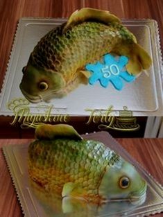 there is a cake shaped like a fish on top of a plate with the number 50