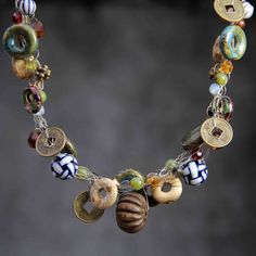 This crocheted wiring necklace is handmade using hand painted ceramic, vintage coin, wood, stone, an eclectic collection of beads. The length of the crocheted wiring necklace is 17-19 inches; or 43-48 cm, with an extension chain of 2 inches in the back. The length is well suited to crew and high necklines, but can equally add a frame to a plunging neckline. If you're interested in other colors, please let me know as we can customize your order. The crochet wiring is organic and free spirited. It Collar Necklaces, Found Object Jewelry, Knotted Necklace, Bold Necklace, Horses Pendant, Mother Of Pearl Necklace, Wire Necklace, Chinese Ceramics, Button Jewelry