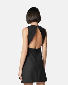 Cutout Wool-Blend Shift Mini Dress Black | Versace US Chic A-line Mini Dress With Structured Shoulders, A-line Mini Dress With Structured Shoulders For Party, Modern H-line Party Dress, Formal Cutout Mini Dress, Elegant A-line Midi Dress With Cutout, Structured Mini Dress For Party, Elegant Fitted Mini Dress With Cutaway Shoulders, Evening Mini Dress With Cutout Back, Formal Mini Dress With Back Opening