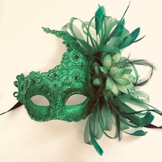 Emerald Green Masquerade Mask for women with stunning green feathers to match. Sparkling rich green colors! Thank you for supporting small businesses and hope our products bring you and loved ones some joy and humor in these trying times. S H I P P I N G - Current processing times range 5-7 days. Pls note expedited & 1-2 day guaranteed delivery services offered will still require the same processing times. S I Z E Fits adults. Dimensions available upon request. C U S T O M I Z A T I O N If y Green Halloween Costume Party Mask, Green Halloween Masquerade Mask And Prosthetics, Green Halloween Masquerade Mask, Green Masks For Mardi Gras Carnival, Green Masks And Prosthetics For Carnival Costume Party, Green Masquerade Mask For Mardi Gras Party, Green Masquerade Mask For Mardi Gras, Green Mask For Masquerade Carnival, Green Masks For Masquerade Carnival