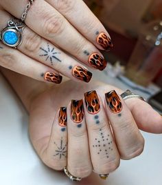 This design embodies the fiery spirit of autumn with its flame-like patterns in shades of black and orange. The sharp contrasts and flowing lines mimic the dynamic movement of fire, making each nail a bold statement piece. It’s a perfect choice for those who want to bring warmth and excitement to cooler fall days Beautiful Fall Nails, Autumn Manicure, Nail Types, Copper Glitter, Green Polish, Flame Art, Dynamic Movement, Blue Polish, Pink Polish