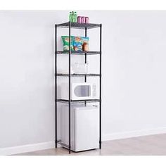 three tiered shelving unit with microwave and dishwasher in the corner, against a white wall