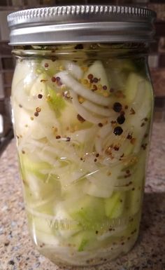 a jar filled with food sitting on top of a counter