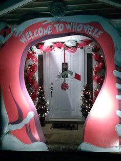 an entrance to a home decorated for christmas