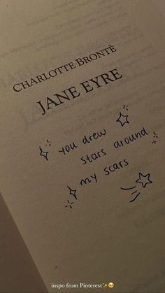 an open book with writing on it that says charlotte brontee jane eyrre