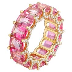 This stunning 14k Yellow Gold Pink Eternity Band Ring is a true symbol of elegance and sophistication. With 150 natural diamonds intricately set around the band, it offers a breathtaking sparkle from every angle. Ring Information Diamond Type : Natural Diamond Metal : 14K Metal Color : Yellow Gold Gold Weight : 4.25g Diamond Carat Weight : 17.2ttcw No of Diamonds : 150 Lead Time : 4-8 Weeks (If out of Stock) JEWELRY CARE Over the course of time, body oil and skin products can collect on Jewelry Baguette Eternity Band, Fireworks Design, Gold Diamond Wedding Band, Diamond Fashion Rings, Professional Jewelry, Eternity Band Ring, Pink Topaz, Classy Jewelry, Gold Band Ring