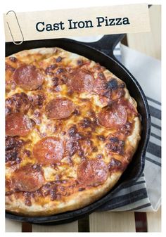 a cast iron pizza sitting on top of a pan