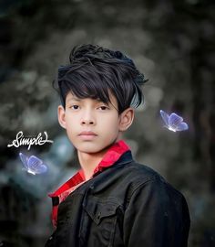 a young boy with black hair and butterflies around him