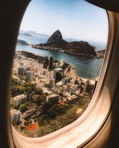 an airplane window looking out at the city