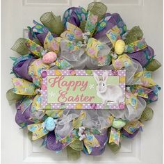 a colorful wreath with an easter bunny on it