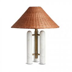 a table lamp with two white columns and a brown shade on it's top