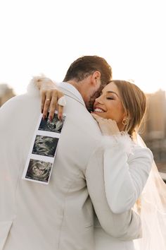 a bride and groom embracing each other in front of the cityscape at sunset